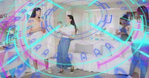 Mothers chatting at baby shower with holographic rings overlay for modern family celebration
