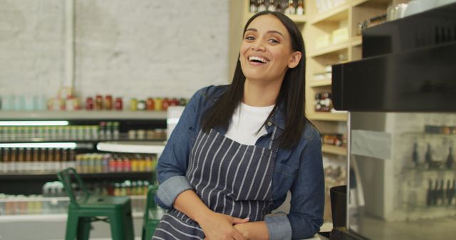 Cheerful Barista in Apron Smiling at Cafe Counter - Download Free Stock Images Pikwizard.com