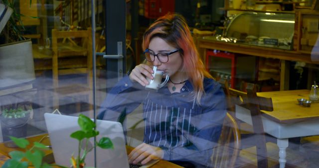 Young Woman Working in Cafe with Laptop and Coffee - Download Free Stock Images Pikwizard.com