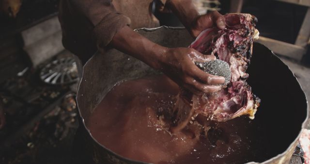 Close-up of Person Cleaning Meat in Rusty Container - Download Free Stock Images Pikwizard.com