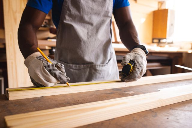 Carpenter Marking Wood Plank in Workshop - Download Free Stock Images Pikwizard.com