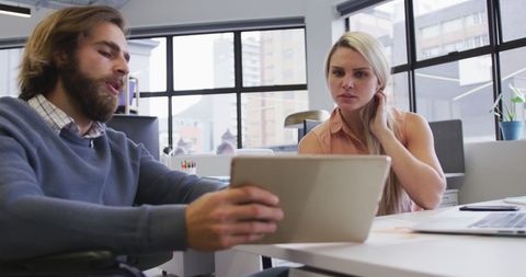 Business Team Discussing Digital Strategy in Modern Office
