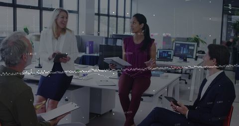 Diverse team engaging in business strategy discussion in modern office