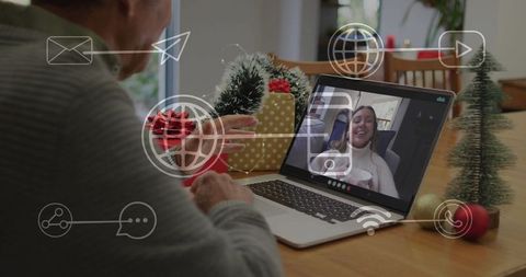 Elderly man video calling family during holiday season