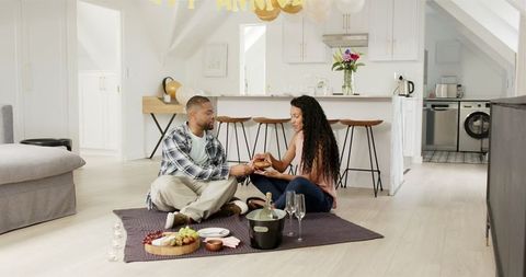 Happy Couple Enjoying Anniversary Celebration at Home