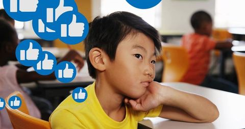 Thoughtful Student in Classroom Engaging with Social Media Icons