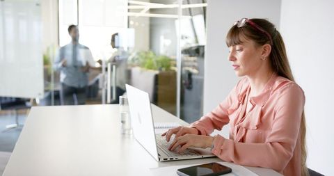 Woman Typing on Laptop in Bright Modern Office - Download Free Stock Images Pikwizard.com