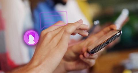 Hand tapping on smartphone with digital chat bubble overlay