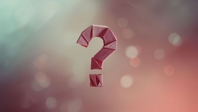 Origami Question Mark Hovering Against Gradient Background