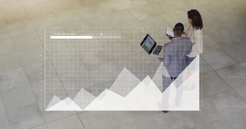 Business Professionals Analyzing Interactive Data in Modern Office