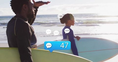 Surfers with social connection on sunny beachfront