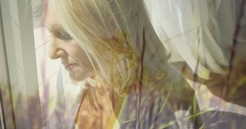 Reflective Portrait of Elderly Woman with Nature Overlay