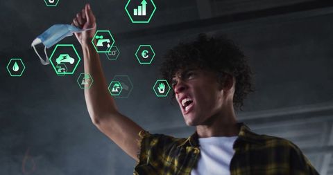 Passionate activist holding mask with futuristic holographic icons