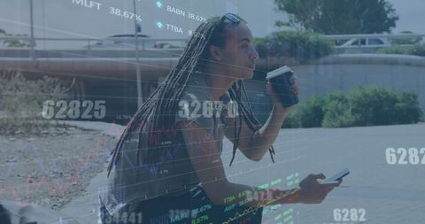 Biracial Man Analyzing Financial Data on Smartphone Outdoors