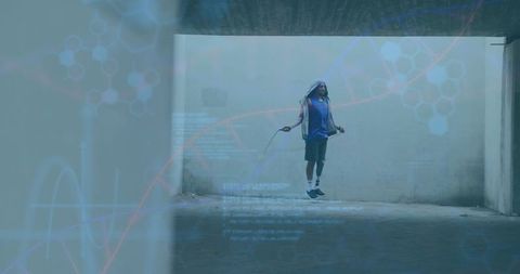 Urban athlete jumping rope in concrete tunnel