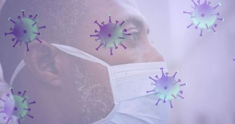 African american senior wearing mask with covid-19 cell overlay