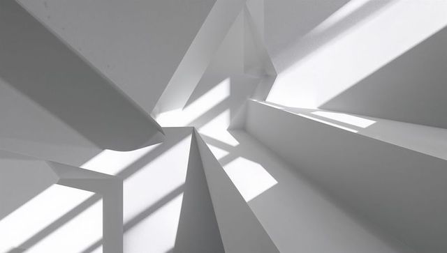 Minimalist architectural interior capturing tall triangular columns, sharp shadow bands