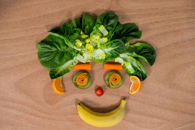 Smiley Face Made of Fruits and Vegetables on Wooden Table - Download Free Stock Photos Pikwizard.com