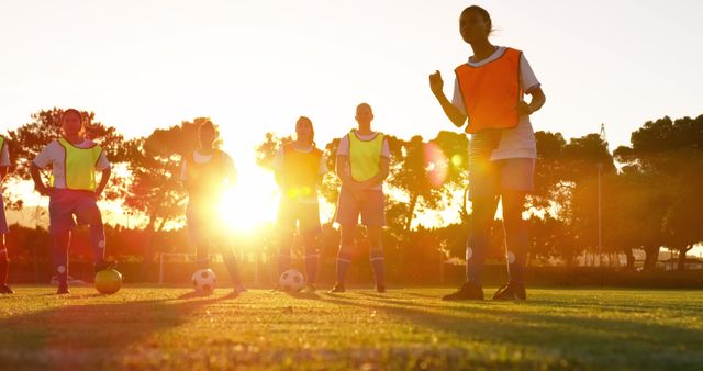 Female Soccer Team Practicing at Sunset - Download Free Stock Images Pikwizard.com