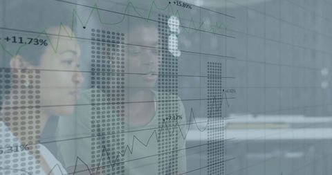 Diverse Professionals Analyzing Financial Data Projections in Modern Office