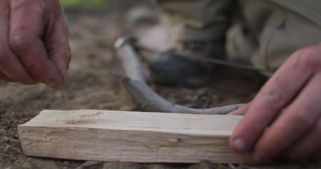 Hands Starting Fire with Wooden Bow Drill in Wilderness - Download Free Stock Images Pikwizard.com