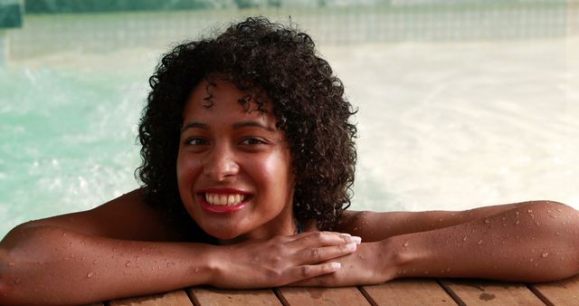 Smiling Woman Relaxing in Pool - Download Free Stock Images Pikwizard.com