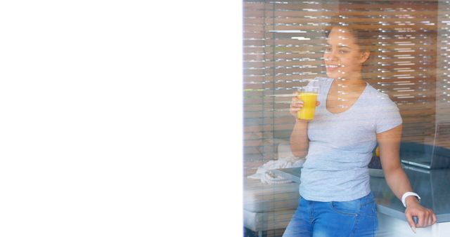 Woman Relaxing with Orange Juice by Window - Download Free Stock Images Pikwizard.com