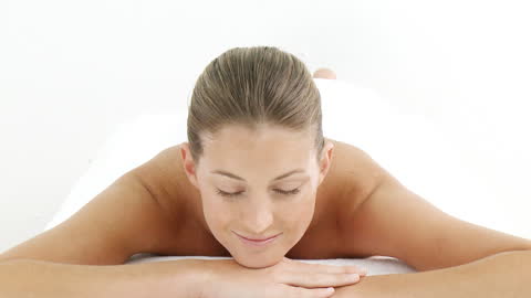 Young Woman Relaxing in Spa Saying Wellness Behind Obvious Highlight