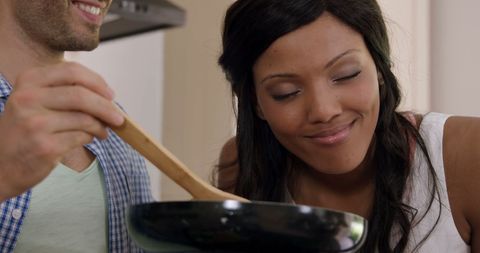Couple Enjoying Cooking Experience Together at Home