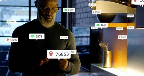Bearded man tapping smartphone summoning floating chat and location badges over counter
