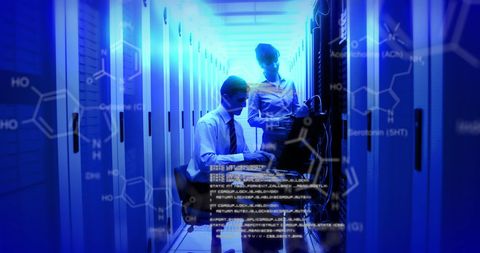 IT Technicians Monitoring Data Servers in Digital Environment