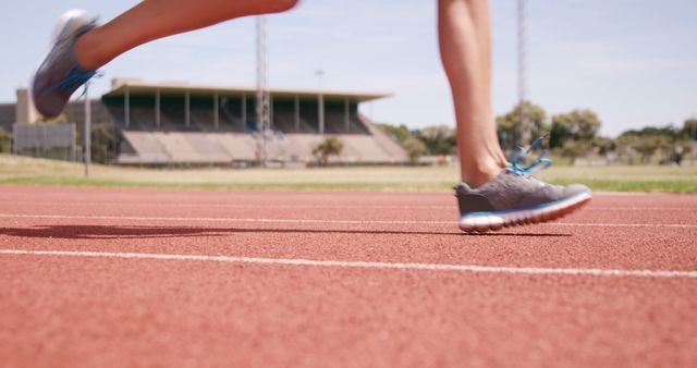 Female Athlete Running on Track During Daytime Training - Download Free Stock Images Pikwizard.com