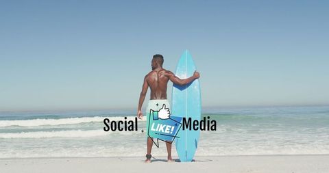 Surfer Holding Blue Surfboard on Vibrant Sandy Beach With Clear Ocean View