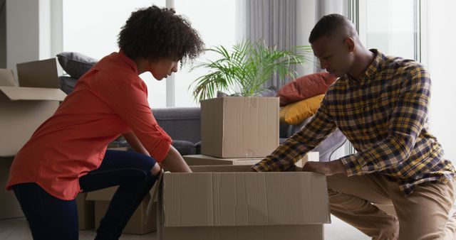 Couple Unpacking Boxes While Moving Into a New Home - Download Free Stock Images Pikwizard.com
