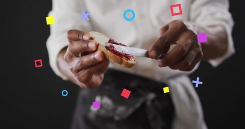 Chef artfully spreading jam on bread