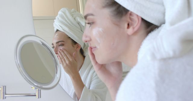 Woman Applying Cream in Bathroom Smiling in the Mirror - Download Free Stock Images Pikwizard.com