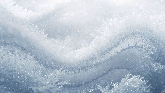 Forming hoarfrost wave on icy surface glittering dendritic crystals blue winter macro