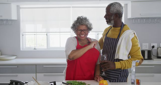 Senior Couple Cooking Together Joyfully in Bright Kitchen - Download Free Stock Images Pikwizard.com