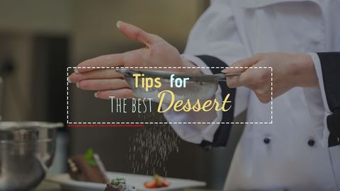 Chef dusting dessert with powdered sugar
