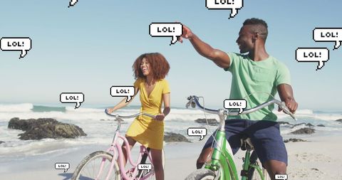 Couple Riding Bicycles on Beach with Digital LOL Speech Bubbles