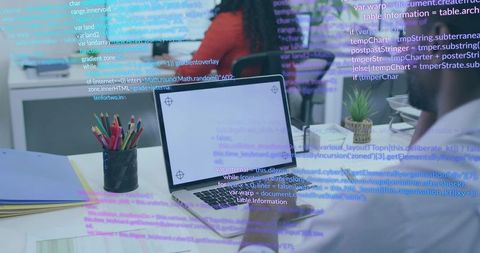 Innovative Teamwork in Modern Office with Coding on Display