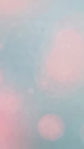 Vertical Abstract Pastel Bokeh Video Featuring Dreamy Pink and Blue Shimmering Orbs