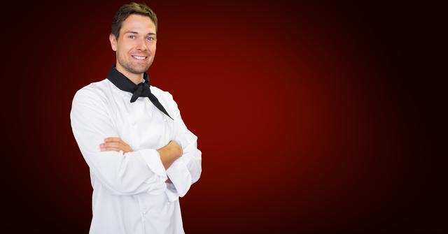 A confident chef standing with arms crossed against a red background. Suitable for themes related to culinary arts, professional kitchens, and the restaurant industry. Ideal for promoting culinary programs, restaurant advertisements, and cooking competitions.