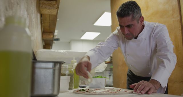 Professional Chef Preparing Gourmet Pizza in Kitchen - Download Free Stock Images Pikwizard.com