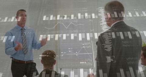 Presenter gesturing during data-driven business meeting with colleagues and analytics overlay