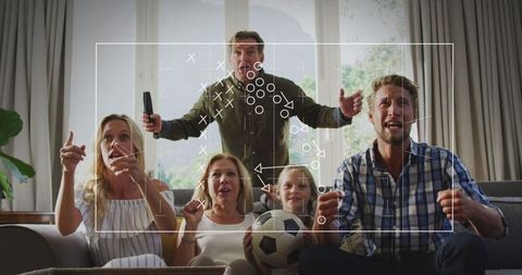 Family Enjoying Soccer Match with Game Strategy Overlay