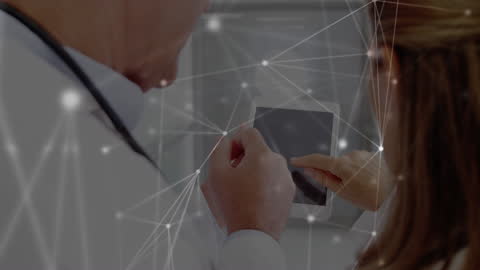 Doctors Using Tablet with Digital Connections Overlay