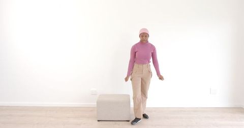 confident woman posing in minimalist interior setting - Download Free Stock Images Pikwizard.com