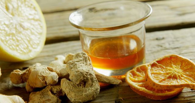 Natural Remedies with Ginger, Honey, and Citrus on Wooden Table - Download Free Stock Images Pikwizard.com