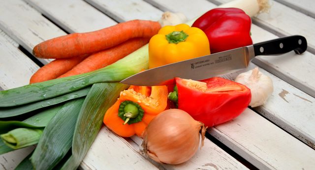 Fresh Vegetables on White Wooden Table with Knife - Download Free Stock Photos Pikwizard.com